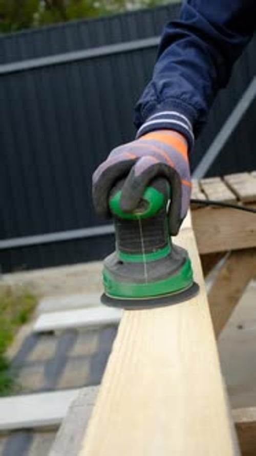Man Sanding Wooden Boards Selective Focus