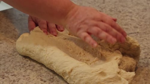 Hands Kneading Dough for Baking at Home
