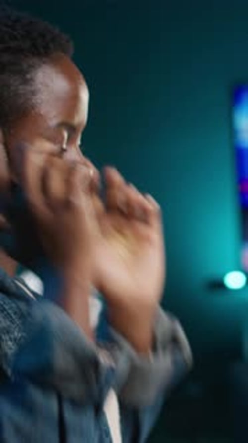 Vertical Video Close Up on Video Editor Putting Headphones on