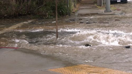 roadway flooding on busy street