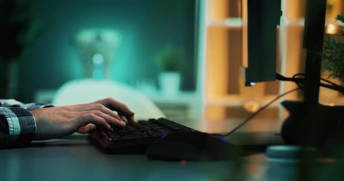 Male hands typing on computer keyboard. Blogger writing an article for blog. Man sitting at his desk