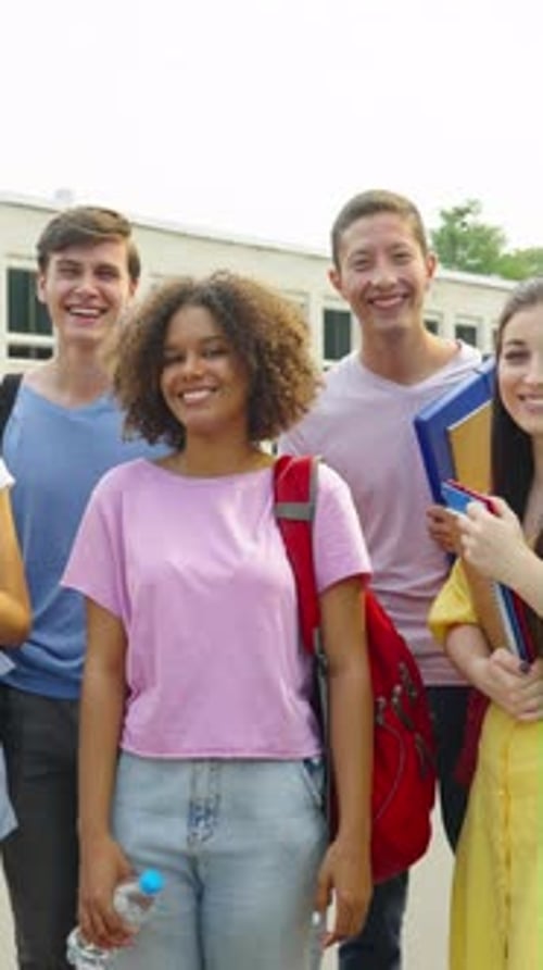 Vertical Screen Diverse Students Showing Thumbs Up Against College