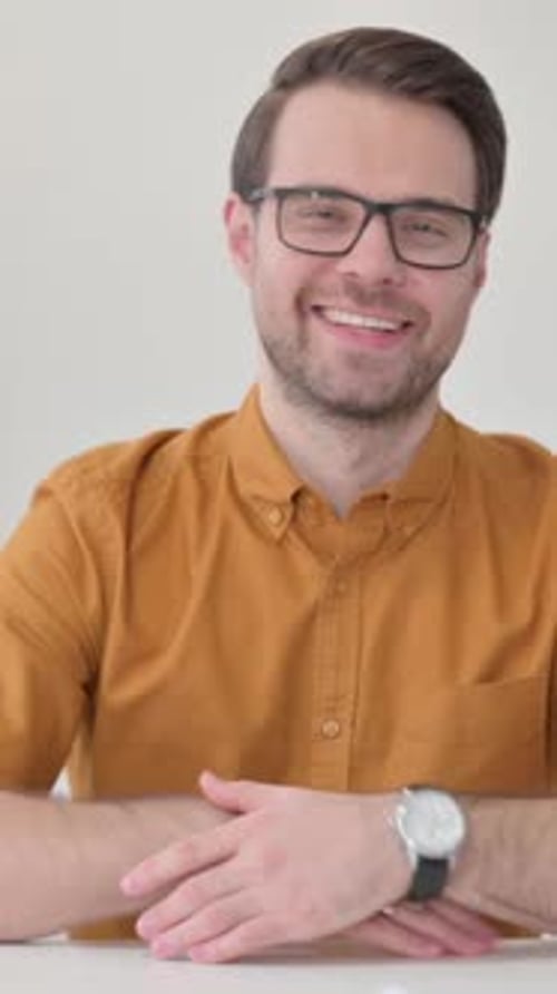 Smiling Man Giving a Thumbs Up Gesture