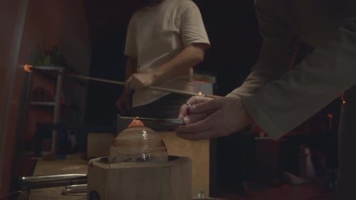 Glassblowers Team Creating Art in Workshop