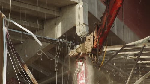 Machine with Knife Disassembles Rubble of Destroyed Arena