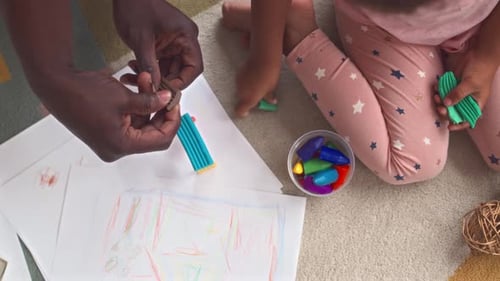 Father and Child Playing with Plasticine Top View