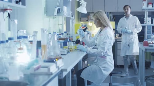 Scientists Conducting Experiment in a Modern Laboratory