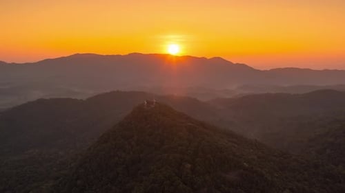 Beautiful aerial view of a mountain with the sun shining golden,