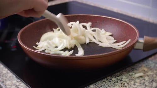 Cooking Sliced Onions in a Pan