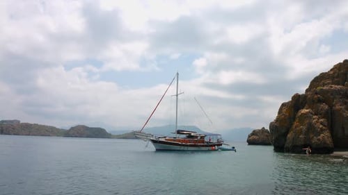 A Boat is Sailing Against the Picturesque Sea View
