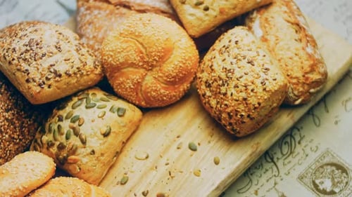 Assortment of Bread on Wooden Board