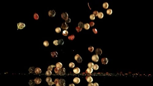 Pepper falling on black surface in slow motion