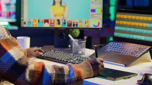 Photo Editor Working on Drawing Tablet in Office