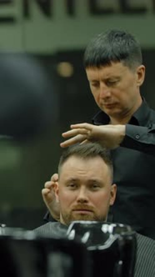 Man Getting Hair Styled by Barber