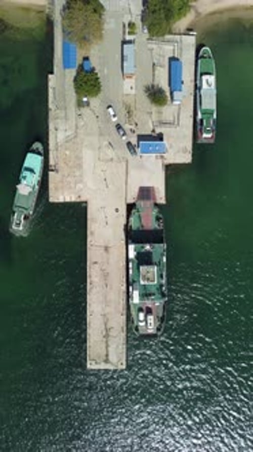 Ferry Carrying Cars and Passengers Across the Sea Top Down Aerial Drone View Aerial Vertical View on