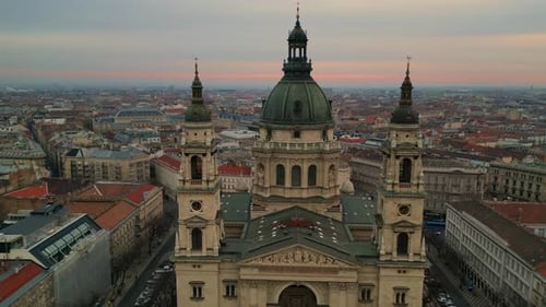 Saint Stephen's Basilica in Budapest during a cloudy sunset aerial drone view