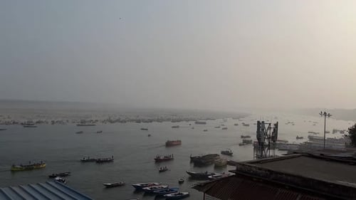 Many Boats Navigating River in the City