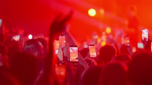 Crowd at Concert Raising Phones to Record Show