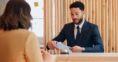 Woman, man and concierge with documents at hotel, welcome or business trip with smile for check in