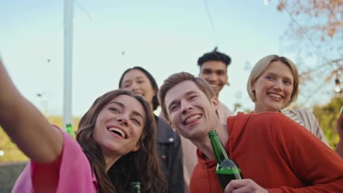 Happy Friends Taking Selfie with Green Bottles