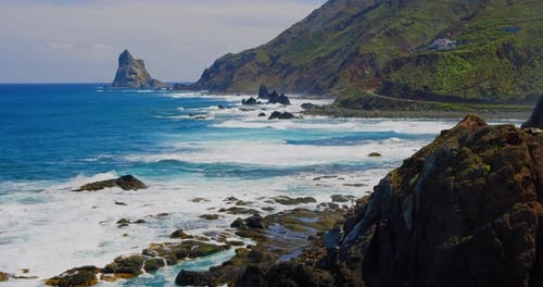 Scenic landscape ocean coast. Highway near to beautiful sea view. Green rocks. Waves splashing, cras