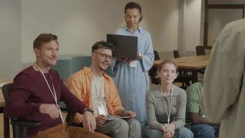 Diverse Group of People Listening in Workplace Meeting