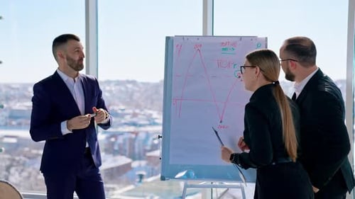 Small group of business people standing at office and solving problem at meeting.