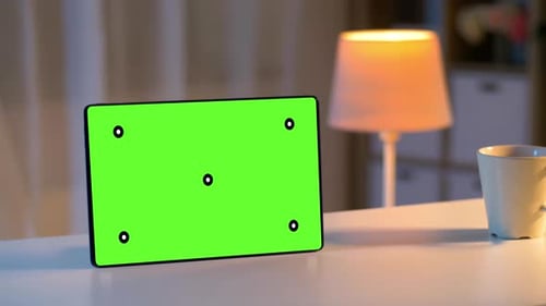 Evening still life tablet computer with chroma key screen at home