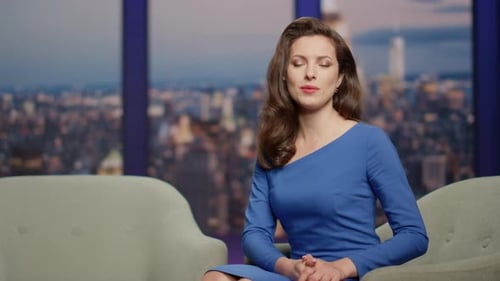 Elegant Anchor Woman Presenting Male Celebrity in Tv Program Studio Closeup