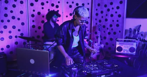 African american band creatively recording reggae song in South Africa studio