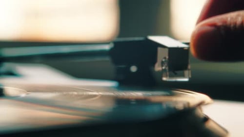Closeup Head of a Vinyl Player Plays Music on a Black Record