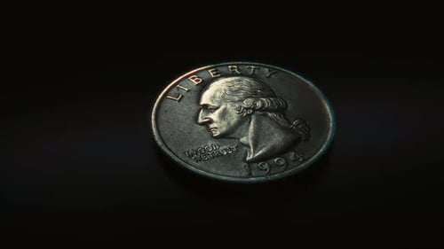 Spinning US Quarter Coin Landing On Heads