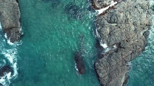 Aerial Top View of Sea Waves Crushing Into the Rocks Near Beach Drone Shot of Sea Waves on the