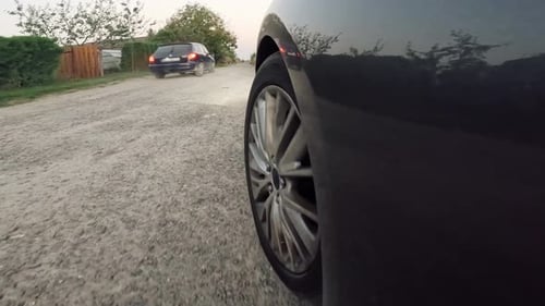 Car driving on a road. Parking an automobile. Shot from car door