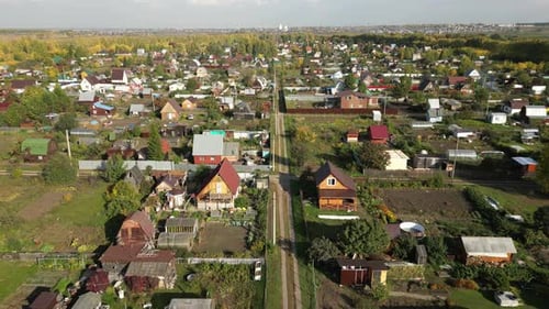 Drone Flight Over Suburban Houses in the Village in Autumn Day Residential Sector