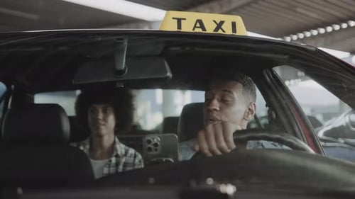 Taxi Driver Getting Paid by Passenger Inside Car