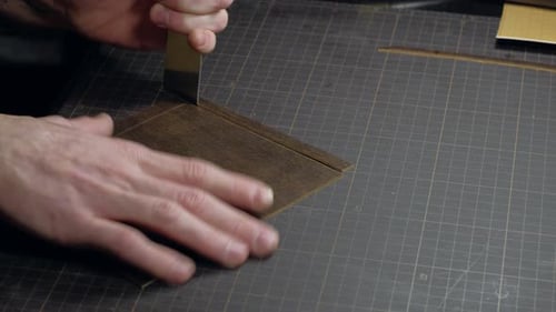 Tanner Cuts Leather Close Up