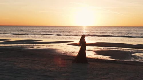 black dress beach photoshoot Summer vacation sunset outfit picture idea | Black dress beach