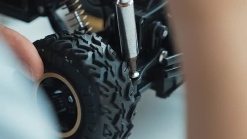 Close up of young student tighten the nut by using screwdriver. Edification