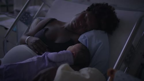 Mother and Baby Bonding in Hospital Bed at Night Fostering Affection and Intimacy