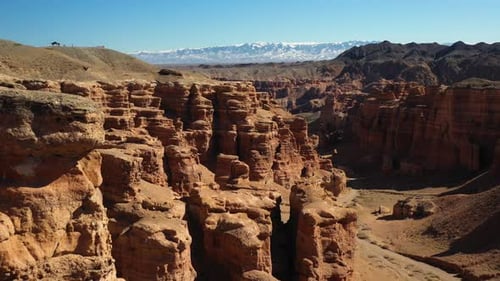 Cinematic drone shot of the red sedimentary rocks in Charyn Canyon, Kazakhstan