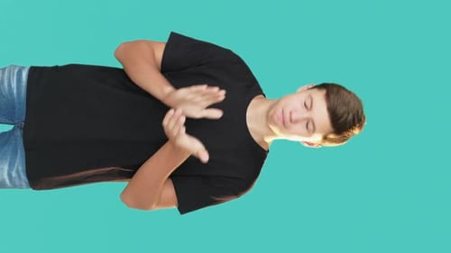 Young Adult Gestures on Green-Blue Background