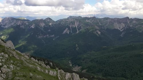 Incredible mountain panorama extending into the distance beyond the horizon. Aerial view.