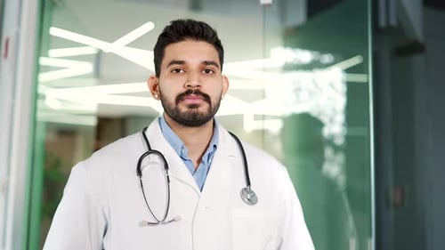 Confident Doctor Looking at Camera in Hospital