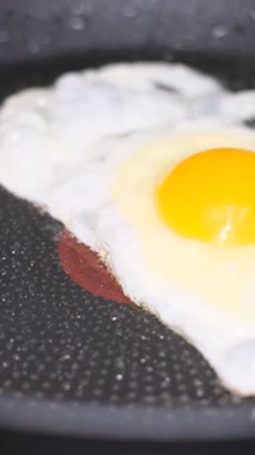 Fried Egg Cooking in Frying Pan Close Up