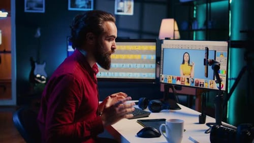 Man Working at Computer in Dimly Lit Office