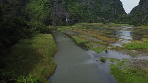 Boats moving slowly on Ngo Dong River, Tam Coc, Natural Wonders