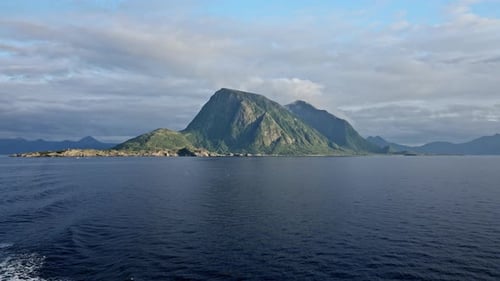 Ferry Journey Amidst Green Mountain Peaks