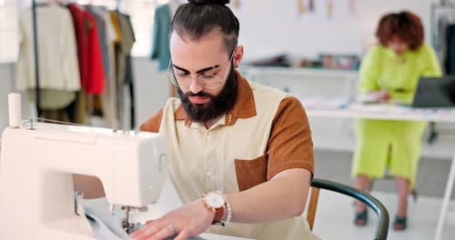 Sewing fabric, male designer and textile sewer working of a man and tailor machine in a studio