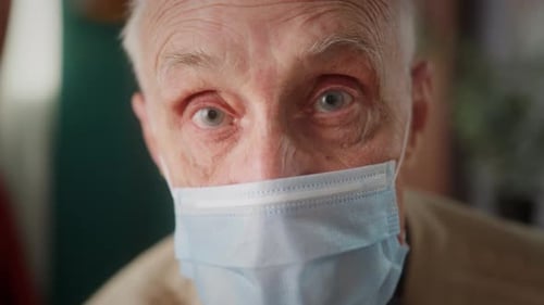 Senior Man Wearing Medical Mask Close Up